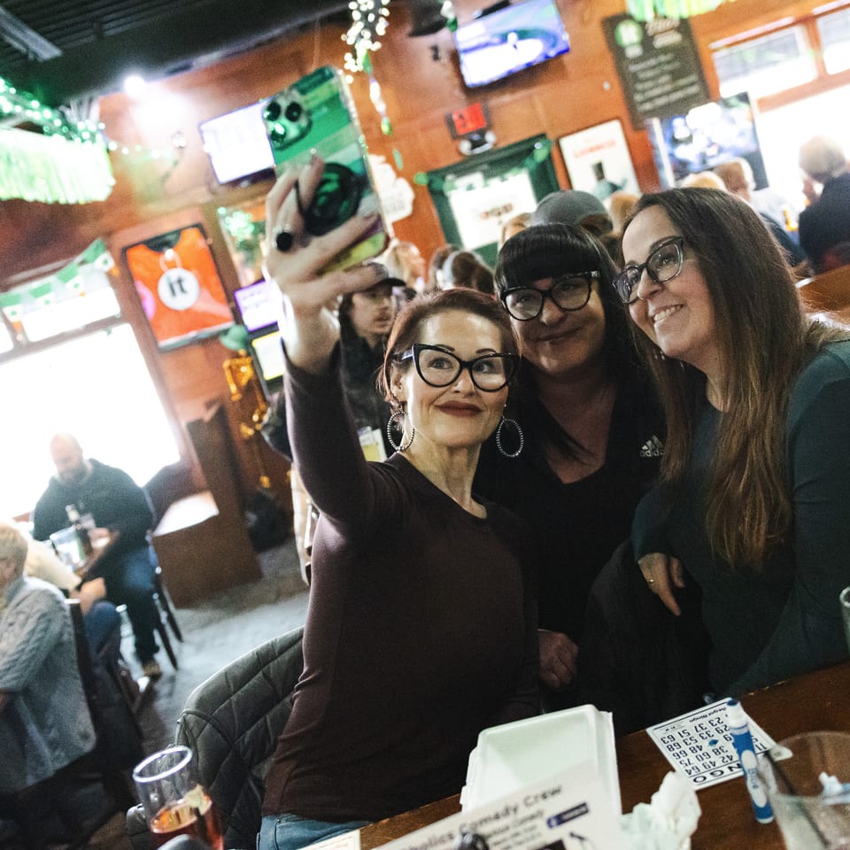 Friends taking a selfie during bingo at the tavern