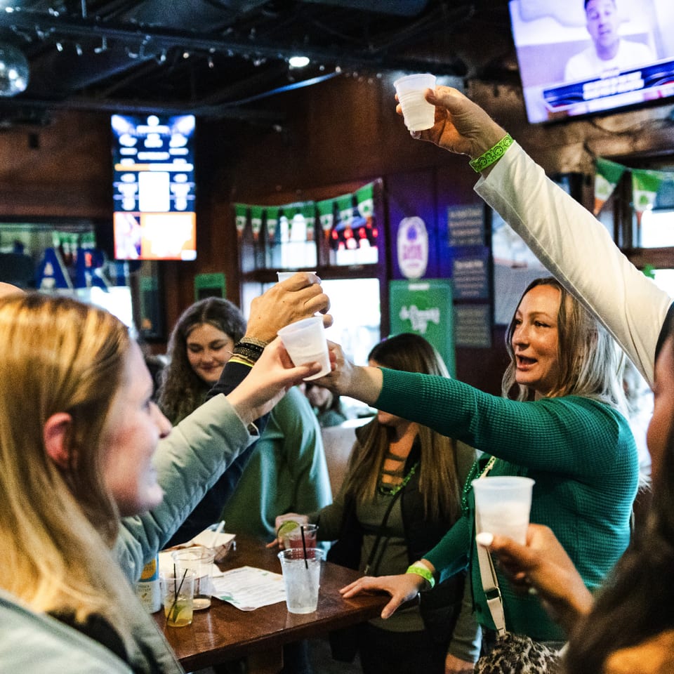 Guests celebrating together inside Irish Tavern