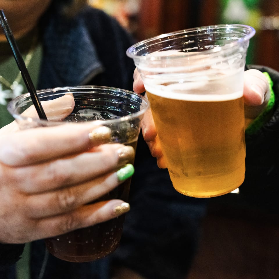 Guests raising their drinks together